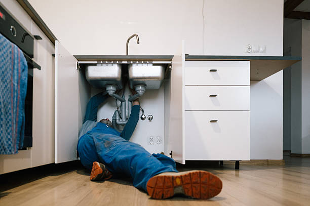 Professional Emergency Plumber technician working in Winger, MN